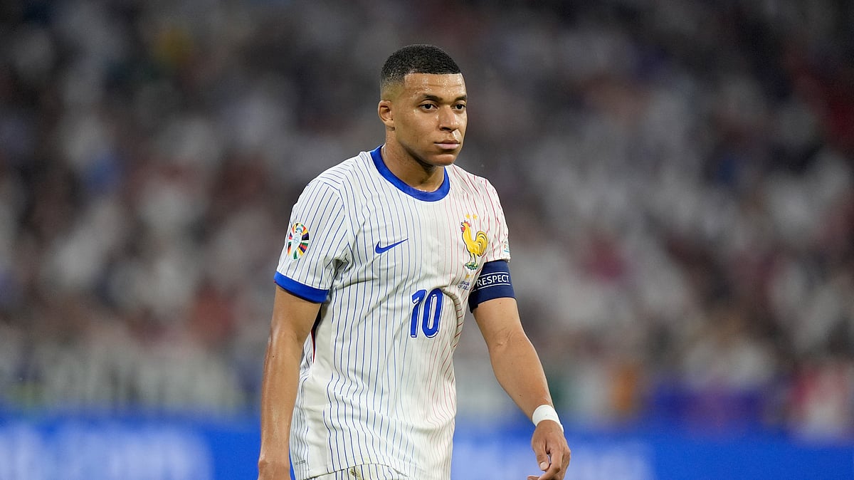 Kylian Mbappe of France walks on the pitch during a semifinal match between Spain and France at the Euro 2024 soccer tournament in Munich, Germany, Tuesday, July 9, 2024. 
 - (AP Photo/Matthias Schrader)

